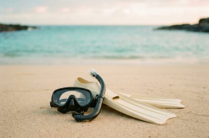 Snorkel set with mask and fins on a Hawaii shoreline
