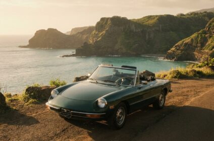 Convertible sports car rental at a Maui coastal overlook